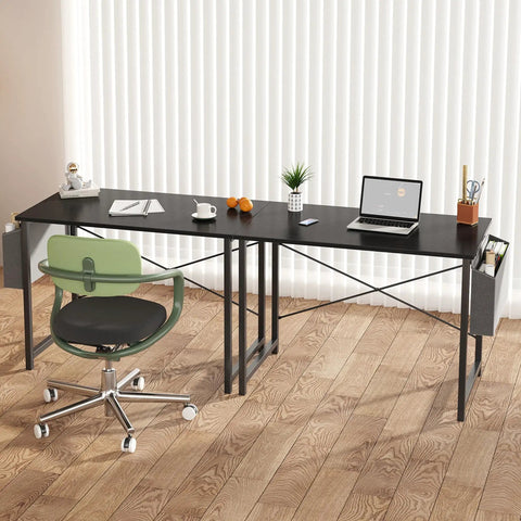 Black space saving computer desk for small spaces 31 inch home office table with steel frame and storage bag, in bedroom setting