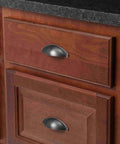 Oil Rubbed Bronze Cup Pulls 3 Inch Center To Center Cabinet Hardware Pack Of 5 with mounting hardware installed on wooden drawers