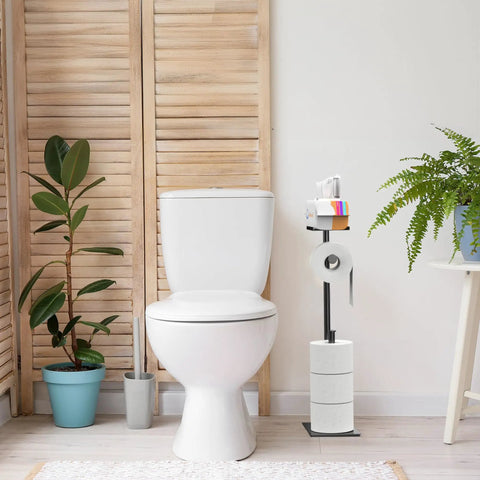 Free Standing Toilet Paper Holder With Phone Shelf, Rust Proof Carbon Steel Stand in bathroom next to plants and toilet