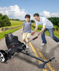 Hoverboard Seat Attachment With Adjustable Straps Go Kart Conversion For Adults And Kids Fits 6.5 8 And 10 Inch self balancing scooters in black on rural road with adult and child