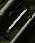Close-up of ultra lightweight titanium keychain pry bar with minimalist slim design everyday carry essential for your keys.