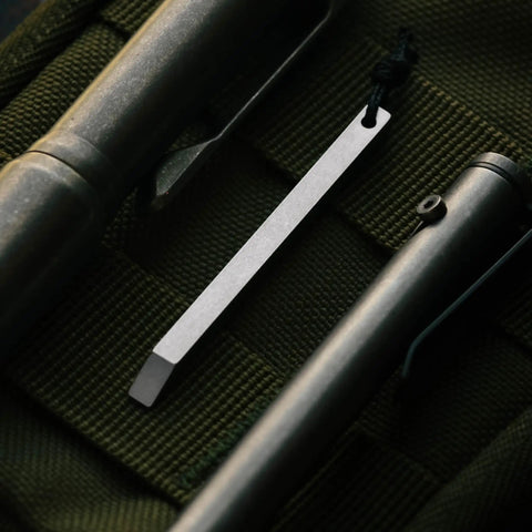 Close-up of ultra lightweight titanium keychain pry bar with minimalist slim design everyday carry essential for your keys.