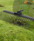 Tow Behind Landscape Rake 60 Inch Dethatcher With 21 Steel Coil Tines on Grass with Tractor Background
