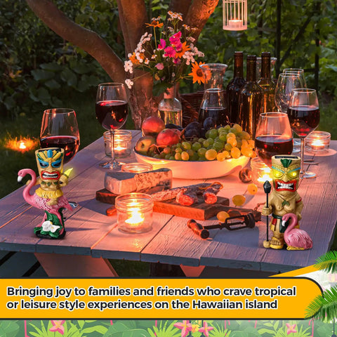 2 Pack Tiki Solar Lights 11.8 Inch Outdoor Tiki Statue Garden Torch Lamps With Flickering Eyes Bar Sign Flamingo Theme Solar Powered Lawn Decor for Patio Balcony Porch and Yard displayed on a decorated picnic table with wine and fruit.