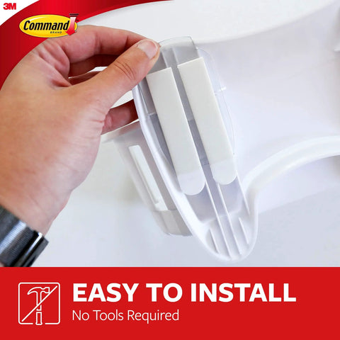 Close-up of attaching the Under Sink Cabinet Caddy With No Tools Needed Holds Up To Seven And A Half Pounds Damage Free Hanging