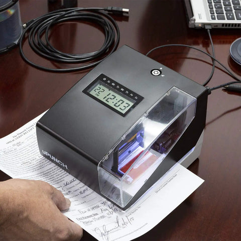 Big Win Digital Time Clock And Date Stamp Combo For Small Business Managers Keep Your Crew On Point With An Easy Punch Card System Including Fifty Time Cards Ink Ribbon And Backup Keys For Smooth Sailing on a desk, showing use with paperwork.