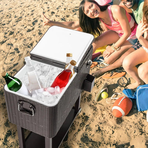 Portable Patio Cooler Bar Cart 80QT Rolling Beverage Station with ice and drinks on beach with people, dark gray rattan.
