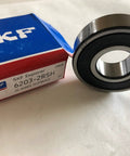 6203 2RSH Radial Deep Groove Ball Bearing with Dual Seals, 17mm Bore, 40mm OD, 12mm Width, Bearing Steel, next to packaging