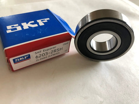 6203 2RSH Radial Deep Groove Ball Bearing with Dual Seals, 17mm Bore, 40mm OD, 12mm Width, Bearing Steel, next to packaging