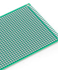 Close-up of one board from 32 Pieces PCB Board Set With Five Sizes Double Sided Prototyping Boards For DIY Electronics Projects Point One Inch Spacing With Corner Mount Holes Soldering Ready