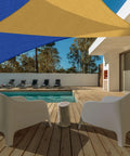 Poolside area with Triangle Sun Shade Sail 16 Foot By 16 Foot By 22.64 Foot UV Block Canopy providing shade over deck chairs