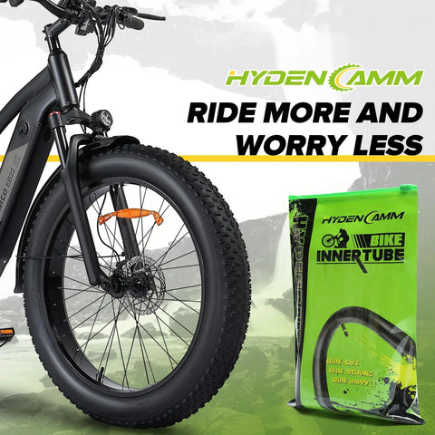 2 Pack Fat Tire Bike Inner Tubes 20x3.0 20x3.3 20x3.5 With Schrader Valve And 2 Tire Levers in packaging beside a fat bike wheel
