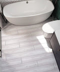 Bathroom with Coastal White Wood Grain Peel And Stick Vinyl Flooring Planks 6x36 In Waterproof Self Adhesive Floor Tiles Easy Install