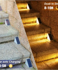 Solar Step Lights Outdoor 12 Pack Waterproof IP67 LED Stair Lights illuminating stone steps with warm white glow at dusk