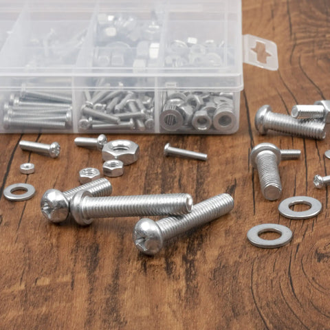 All In One 500 Pcs Screws Nuts And Washers Set With 130 Phillips Bolts 125 Hex Nuts And 245 Metal Washers In 10 Sizes M3 M4 M5 M6 M8 In A Handy Organizer Box For Home Repairs And DIY Projects on wooden surface