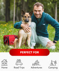Man with dog next to red Cat And Dog First Aid Kit For Home And Travel With Thermometer Wound Care Supplies Bandages Antiseptic in park.