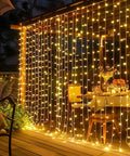 Warm White 300 LED Curtain Lights For Bedroom And Window Backdrop Indoor Outdoor Fairy String Lights illuminate patio dining area