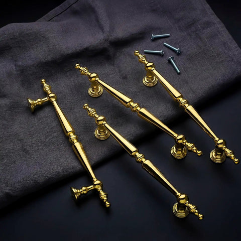 Heavy Duty Vintage Gold Cabinet Drawer Pulls Sweet Set Of 10 Handles With Antique Brass Finish displayed on dark fabric.