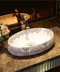 Slick Oval Ceramic Bathroom Sink For Countertop Vanity Rock Solid Above Counter Style With Pop Up Drain No Overflow Easy Setup Knockout Look For Small Half Baths And Daily Home Refreshers on marble countertop with elegant design.