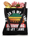 Dragon Boat Paddler Tote Bag filled with groceries, drinks, and flowers, featuring a colorful graphic and text design.