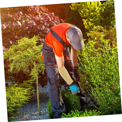 Person wearing Heavy Duty Aramid Arm Guards For Women, Badass Forearm Shields For Gardening And Yard Work, Cut Resistant Sleeves while gardening.