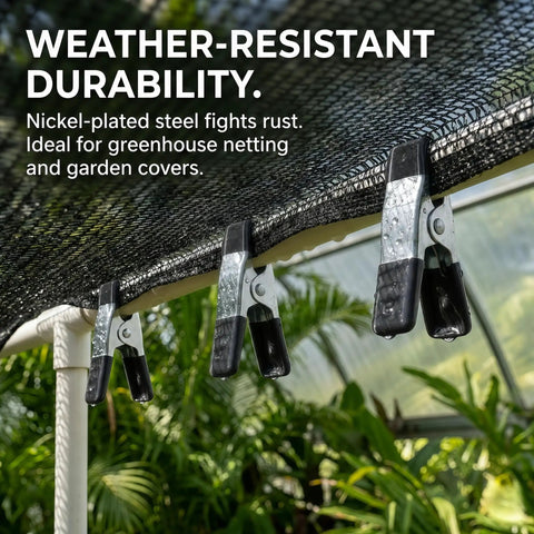 Straight Up Kicking 40 Pack Mini Spring Clamps Heavy Duty Nickel Plated Steel Clips securing greenhouse netting outdoors.