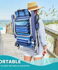 Person carrying Backpack Beach Chairs For Adults Half Pack Foldable Heavy Duty Camping Chair, blue with large pockets, on boardwalk
