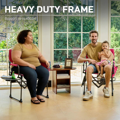 People seated in Compact Folding Directors Chair With Side Table And Pocket Pink Heavy Duty Lawn Chair For Camping And Outdoors Supports Up To 400lbs Portable Lightweight 13lbs Aluminum Iron Build Easy Carry, indoors with heavy duty frame supporting up to 400lbs.