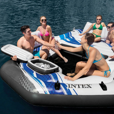 Group enjoying Blue Tropic Inflatable Five Person Pool Island Lounge Raft with backrests, cooler, and cupholders in lake.