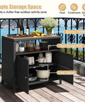 Outdoor Wicker Bar Cabinet With PE Rattan Construction, Durable Acacia Wood Countertop, Open Shelf And Two Doors on patio