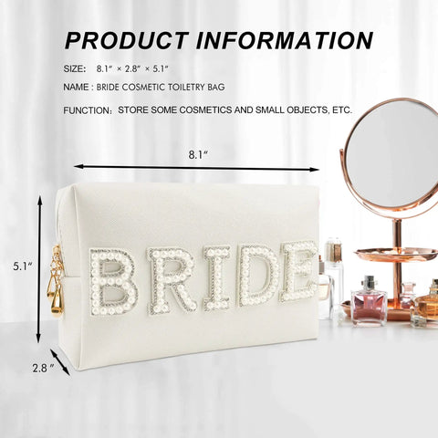 Bride Patch Makeup Bag With White Pearl Rhinestones For Women, Travel Toiletry Pouch on tabletop next to mirror and perfumes