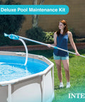 Woman using Deluxe Above Ground Pool Maintenance Kit with Vacuum for 800 GPH Flow Rate, 110 Inch Pole, 24 Foot Hose Color May Vary
