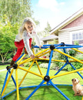 Child climbing on 6 Ft Geometric Dome Climber for Kids Indoor Outdoor Play Set with Durable Climbing Grips Supports Up To 600 Lbs