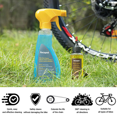 Bike Chain Cleaner Kit With Chain Lubricant And Biodegradable Degreaser bottles on grass near bike wheel