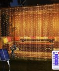 Solar Curtain Lights 300 LED Fairy String Lights With USB and Solar Dual Power for Indoor Outdoor Use on a patio with remote