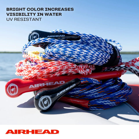 75 Foot Water Ski Rope With Tractor Grip Handle 1 Section Aluminum Core 12 Inch Grip Blue And White Great For Wakeboarding And Kneeboarding Durable Tow Line For A Smooth Ride coiled on a boat, showcasing bright color and UV resistance.