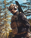 Person carrying Soft Rifle Case With Adjustable Shoulder Sling And External Pocket Durable 44 Inch Long Gun Case For Shotguns And Scoped Rifles Padded Fits Up To 41 Inch Black Gear Bag.