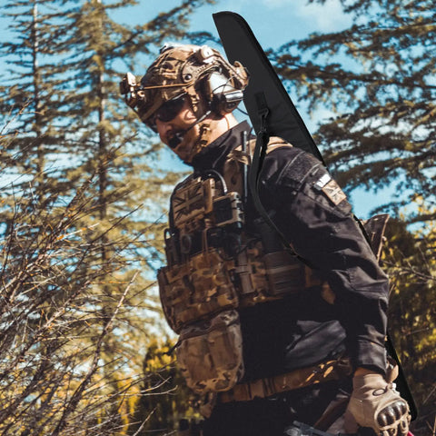 Person carrying Soft Rifle Case With Adjustable Shoulder Sling And External Pocket Durable 44 Inch Long Gun Case For Shotguns And Scoped Rifles Padded Fits Up To 41 Inch Black Gear Bag.