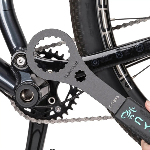Bike Bottom Bracket Tool 16 By 44mm Install And Removal Wrench For Shimano Hollowtech II BB next to bicycle drivetrain