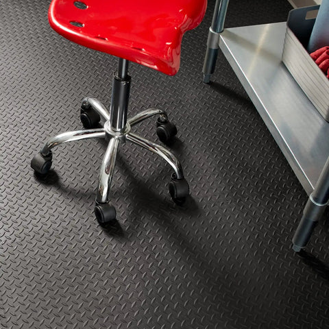 Interlocking Rubber Floor Tiles 18x18 Inch Diamond Plate Squares That Are Tough-As-Nails for Home Gym, shown with a red chair on top.