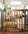 Living room view of Oak Wood And Metal Baby And Pet Gate For 36 To 60 Inch Openings, 30 Inch Tall, auto close feature.