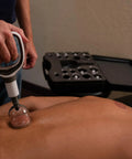Ultimate Pro Cupping Therapy Set With 18 Multi Sized Vacuum Cups Two Hand Pumps And Detailed Cupping Guide in use on a back