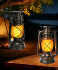 Two Bronze Vintage Solar Lanterns on table, LED glowing at night, for camping, patio. Bronze Vintage Solar Lanterns Two Pack Outdoor Lights