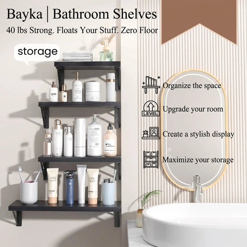 Straight Up Sleek Wall Mounted Floating Shelves In Matte Black Solid Set Of Four arranged with toiletries in a modern bathroom.