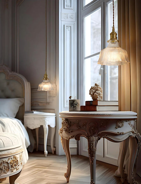 Classic bedroom with decorative table and hanging pendant light, showcasing elegant design details with a warm ambiance.