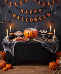 Slick Top Notch Two Pack Black 6Ft Fitted Tablecloth Rectangle Spandex Blend Cover used at a Halloween party table with decorations.