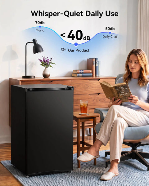 Compact 3.0 Cubic Foot Upright Mini Freezer In Black, quiet operation under 40dB, in a cozy living room setting.