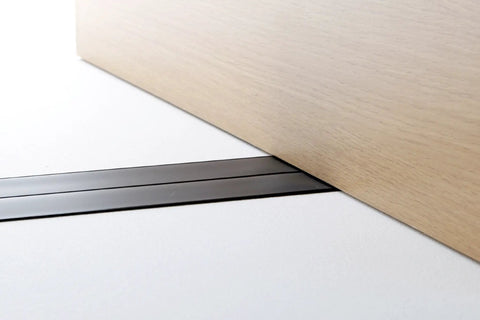 Super Thin Flat Extension Cord For Home Office Travel Ultra Slim Low Profile Power Cable Runs Under Carpet zero bump design shown under furniture.