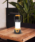 Rechargeable LED Camping Lantern With 1000 Lumens, Five Light Modes, And Memory Function on wooden table