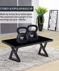 Two 500 lbs kettlebells on a table supported by Beefy 16 Inch Metal Table Legs Set Of 2 In Black For DIY Coffee Tables Benches End Tables TV Stands And Nightstands Heavy Duty Steel Pipe Construction Ready To Install.